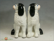 https://warrenantiques.com/products/a-pr-of-english-black-and-white-superb-disraeli-spaniels-with-separate-legs-c1860
