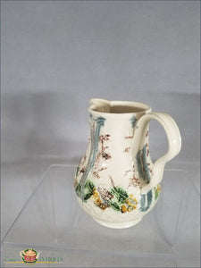 https://warrenantiques.com/products/an-english-creamware-greatbatch-fruit-basket-milk-jug-c1770-82