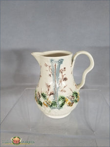 https://warrenantiques.com/products/an-english-creamware-greatbatch-fruit-basket-milk-jug-c1770-82