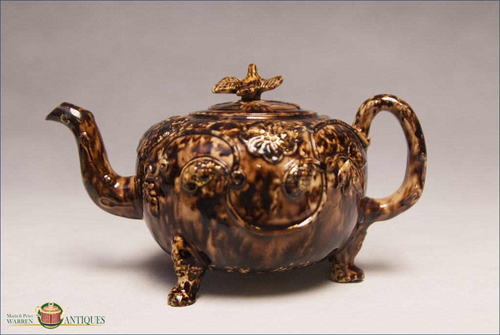 An English Creamware Whieldon style Tortoiseshell glazed teapot and ...