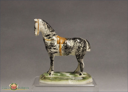 https://warrenantiques.com/products/staffordshire-horse-in-pratt-colors-c1770-80