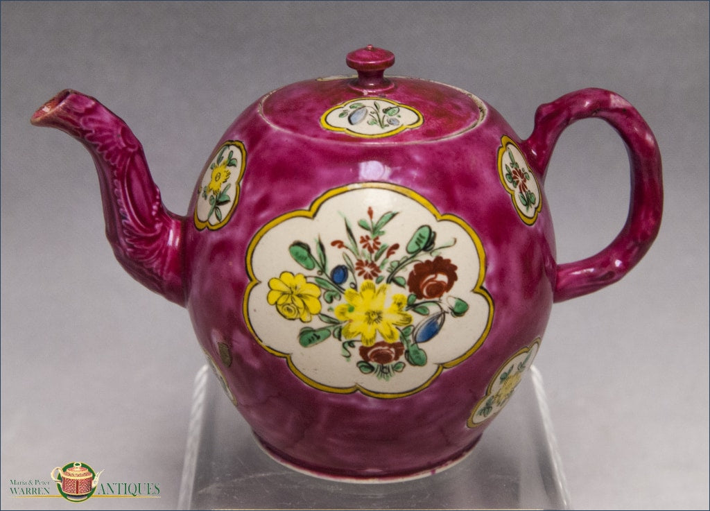 https://warrenantiques.com/products/saltglaze-teapot-in-puce-ground-with-foliate-decoration-c1750