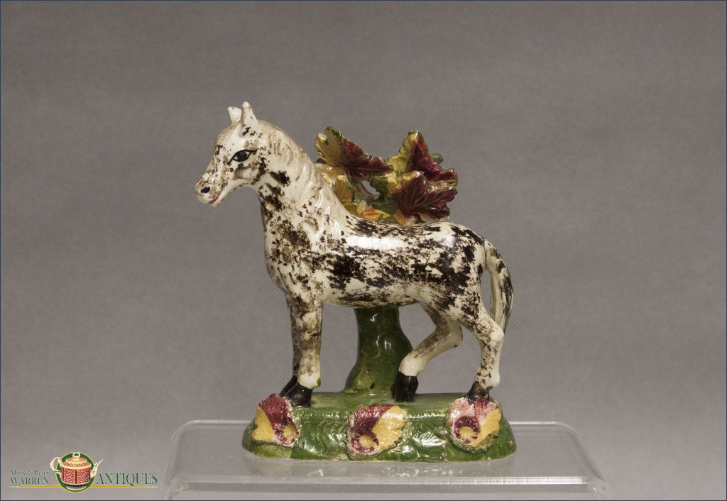 https://warrenantiques.com/products/english-staffordshire-horse-with-bocage-c1840-50