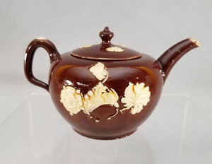 https://warrenantiques.com/products/an-english-staffordshire-glazed-redware-teapot-and-cover-c1740-50