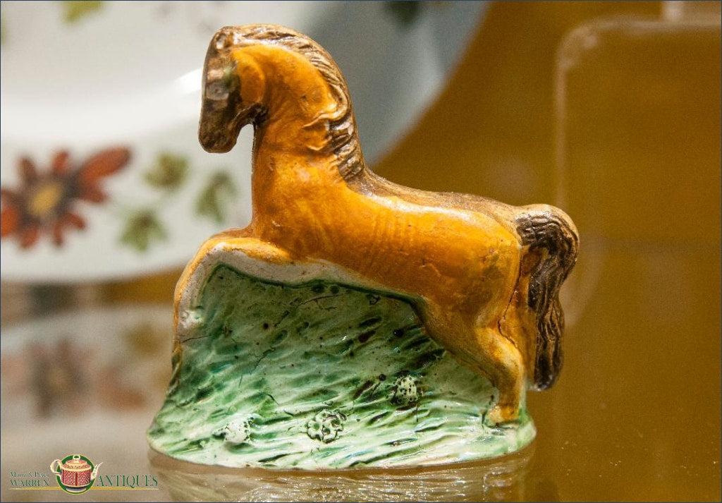 An English Staffordshire horse, decorated in underglaze Pratt