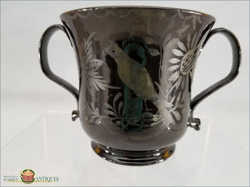 https://warrenantiques.com/products/english-jackfield-loving-cup-decorated-with-a-bird-and-flowers-on-both-sides-c1780-90