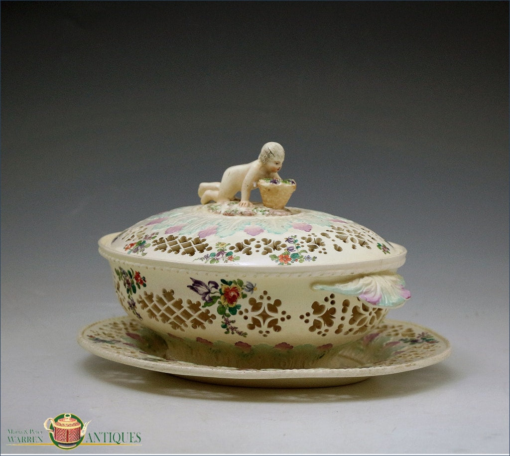 https://warrenantiques.com/products/rare-english-pottery-polychrome-decorated-creamware-chesnut-basket-cover-and-stand-c1780-90